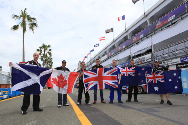 Marino Franchitti of the UK of Lucas Dumbrell Motorsport (L-R), Alex Tagliani of Kelly Racing, Andy Priaulx of Triple Eight Racing, Oliver Gavin of Kelly Racing, Richard Lyons of Ford Performance Racing, Shane Van Gisbergen of Stone Brothers Racing and Todd Kelly of Kelly Racing hold their national flags during the Armor All Gold Coast 600, event 11 of the 2011 V8 Supercars Championship at the Queensland Raceway, Ipswich, Queensland, October 20, 2011.
World Copyright: Mark Horsburgh/LAT Photographic
ref: flags-EV11-11-0953