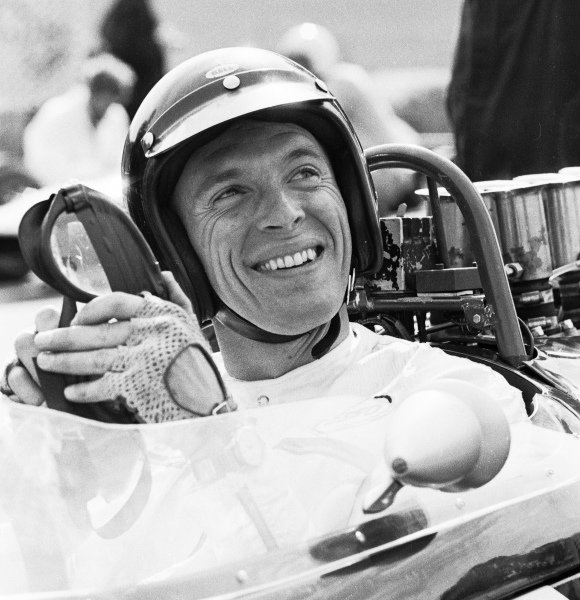 Dan Gurneyis all smiles before the start of the 1964 British Grand Grand Prix at Brands Hatch.