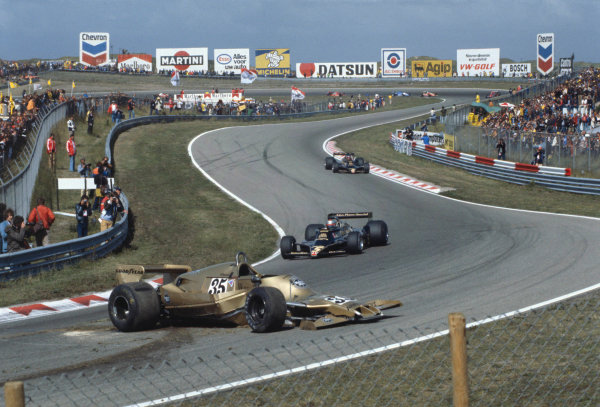 1978 Dutch Grand Prix.
Zandvoort, Holland. 
25-27 August 1978.
Mario Andretti and Ronnie Peterson (both Lotus 78 Ford's) pass the crashed car of Riccardo Patrese (Arrows A1-Ford Cosworth). They finished in 1st and 2nd positions respectively.
A Race Through Time exhibition number 75.
World Copyright - Dunbar/LAT Photographic

