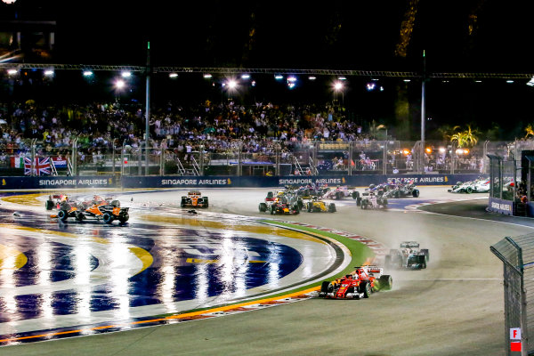 Marina Bay Circuit, Marina Bay, Singapore.
Sunday 17 September 2017.
Sebastian Vettel, Ferrari SF70H, leads Lewis Hamilton, Mercedes F1 W08 EQ Power+, as Kimi Raikkonen, Ferrari SF70H, and Max Verstappen, Red Bull Racing RB13 TAG Heuer, crash out in the background.
World Copyright: Charles Coates/LAT Images
ref: Digital Image AN7T9556 Marina Bay Circuit, Marina Bay, Singapore.
Sunday 17 September 2017.
Sebastian Vettel, Ferrari SF70H, leads Lewis Hamilton, Mercedes F1 W08 EQ Power+, as Kimi Raikkonen, Ferrari SF70H, and Max Verstappen, Red Bull Racing RB13 TAG Heuer, crash out in the background.
World Copyright: Charles Coates/LAT Images
ref: Digital Image AN7T9556