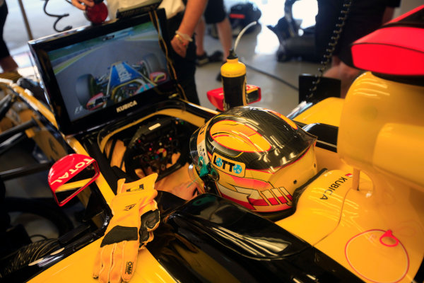 Suzuka Circuit, Suzuka, Japan.
10th October 2010.
Robert Kubica, Renault R30, watches the view from his teammate's onboard camera. Portrait. Helmets. 
World Copyright:Andrew Ferraro/LAT Photographic
ref: Digital Image AF5D9783