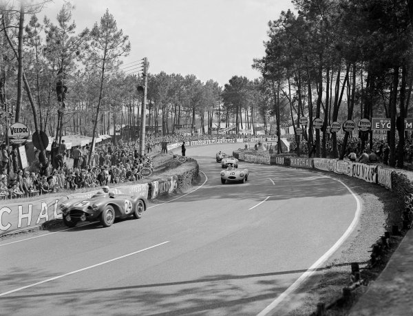 1955 Le Mans 24 hours.
Le Mans, France. 11-12 June 1955.
Roy Salvadori/Peter Walker (Aston Martin DB3S) leads Johnny Claes/Jacques Swaters (Jaguar D-type, 3rd position), "Pierre Levegh"/John Fitch (Mercedes-Benz 200SLR) and Reg Parnell/Dennis Poore (Lagonda DP166). "Levegh" later crashed into the crowd killing himself and 80 spectators.
Ref-Motor 716/24.
World Copyright - LAT Photographic 1955 Le Mans 24 hours.
Le Mans, France. 11-12 June 1955.
Roy Salvadori/Peter Walker (Aston Martin DB3S) leads Johnny Claes/Jacques Swaters (Jaguar D-type, 3rd position), "Pierre Levegh"/John Fitch (Mercedes-Benz 200SLR) and Reg Parnell/Dennis Poore (Lagonda DP166). "Levegh" later crashed into the crowd killing himself and 80 spectators.
Ref-Motor 716/24.
World Copyright - LAT Photographic