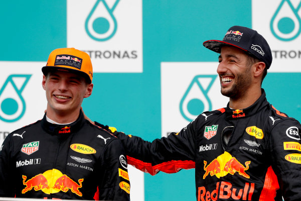 Sepang International Circuit, Sepang, Malaysia.
Sunday 1 October 2017.
Max Verstappen, Red Bull, 1st Position, and Daniel Ricciardo, Red Bull Racing, 3rd Position, on the podium.
World Copyright: Glenn Dunbar/LAT Images 
ref: Digital Image _X4I4012