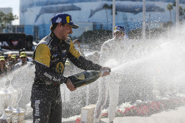 #5 Mustang Sampling Racing Cadillac DPi, DPi: Joao Barbosa, Filipe Albuquerque, #6 Acura Team Penske Acura DPi, DPi: Juan Pablo Montoya, Dane Cameron, #7 Acura Team Penske Acura DPi, DPi: Helio Castroneves, Ricky Taylor celebrate on the podium with champagne