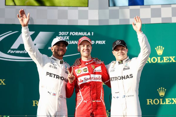 Albert Park, Melbourne, Australia.
Sunday 26 March 2017.
Lewis Hamilton, Mercedes AMG, 2nd Position, Sebastian Vettel, Ferrari, 1st Position, and Valtteri Bottas, Mercedes AMG, 3rd Position, on the podium.
World Copyright: Glenn Dunbar/LAT Images
ref: Digital Image _X4I4218 Albert Park, Melbourne, Australia.
Sunday 26 March 2017.
Lewis Hamilton, Mercedes AMG, 2nd Position, Sebastian Vettel, Ferrari, 1st Position, and Valtteri Bottas, Mercedes AMG, 3rd Position, on the podium.
World Copyright: Glenn Dunbar/LAT Images
ref: Digital Image _X4I4218