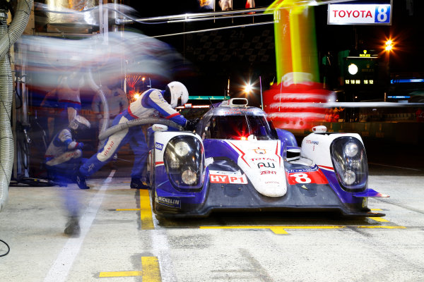 2014 Le Mans 24 Hours.
Circuit de la Sarthe, Le Mans, France.
Sunday 15 June 2014.
Anthony Davidson/Nicolas Lapierre/Sabestien Buemi, Toyota Racing, No.8 Toyota TS 040 Hybrid, makes a night pit stop
World Copyright: Adam Warner/LAT Photographic.
ref: Digital Image _L5R2966