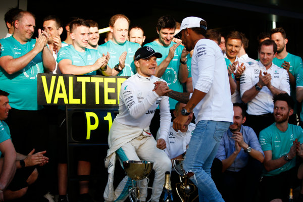 Sochi Autodrom, Sochi, Russia.
Sunday 30 April 2017.
Valtteri Bottas, Mercedes AMG, is congratulated on his victory by Lewis Hamilton, Mercedes AMG, as colleagues applaud.
World Copyright: Andy Hone/LAT Images
ref: Digital Image _ONZ2496