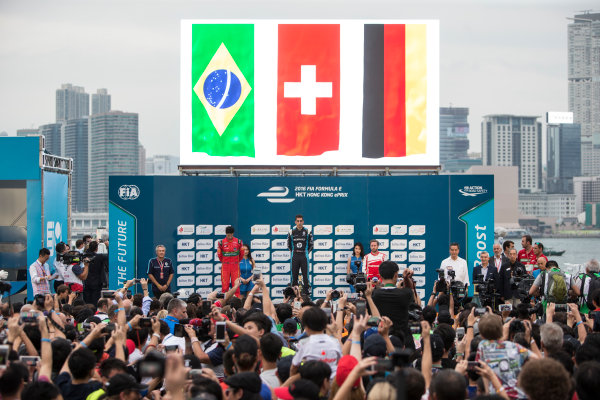 2016/2017 FIA Formula E Championship.
Hong Kong ePrix, Hong Kong, China.
Sunday 9 October 2016.
Lucas Di Grassi (BRA), ABT Schaeffler Audi Sport, Spark-Abt Sportsline, ABT Schaeffler FE02, Sebastien Buemi (SUI), Renault e.Dams, Spark-Renault, Renault Z.E 16 and Nick Heidfeld (GER), Mahindra Racing, Spark-Mahindra, Mahindra M3ELECTRO on the podium.
Photo: Andrew Ferraro/LAT/Formula E
ref: Digital Image _FER2404