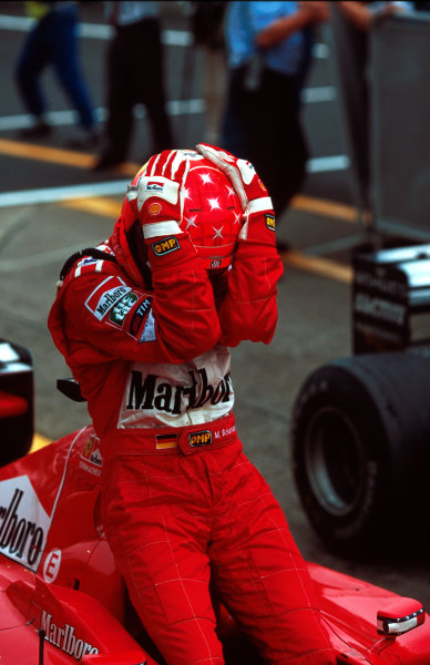 Suzuka, Japan.
6-8 October 2000.
Michael Schumacher (Ferrari) celebrates after winning the Grand Prix and the drivers World Championship. 
World copyright - LAT Photographic