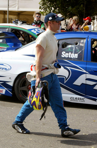 2004 Australian V8 Supercars.
Non-Championship Round. Albert Park, Melbourne, 5th - 7th March.
V8 Supercar driver Greg Murphy walks to his VY Commodore wearing the now compulsory neck to toe fire suit minus the sleeves. 
World Copyright: Mark Horsburgh/LAT Photographic
ref: Digital Image Only