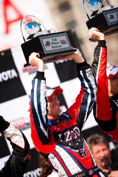 Long Beach. California, USA. 16th - 18th April 2010. 
Ryan Hunter - Reay, (Andretti Autosport) celebrates victory on the podium with Justin Wilson, (Dreyer and Reinbold Racing) and Will Power, (Verizon Team Penske). 
Portrait.   
World Copyright: Drew Gibson/LAT Photographic. 
Digital Image _Y2Z2561