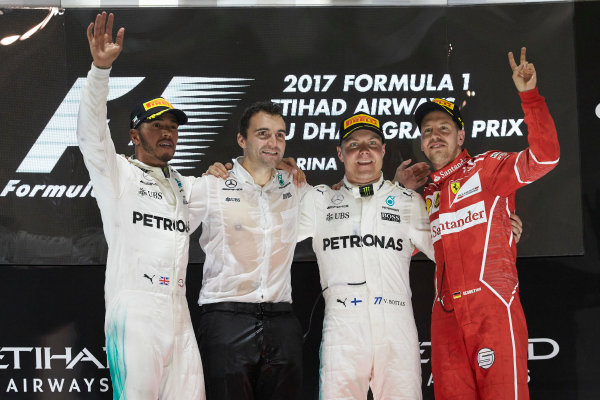 Yas Marina Circuit, Abu Dhabi, United Arab Emirates.
Sunday 26 November 2017.
Lewis Hamilton, Mercedes AMG, 2nd Position, Valtteri Bottas, Mercedes AMG, 1st Position, and Sebastian Vettel, Ferrari, 3rd Position, celebrate on the podium.
World Copyright: Steve Etherington/LAT Images 
ref: Digital Image SNE13360