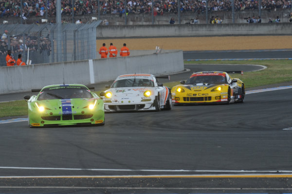 Circuit de La Sarthe, Le Mans, France. 13th - 17th June 2012. 
Race
Tracy Krohn/Nicolas Jonsson/Michele Rugolo, Krohn Racing, No
57 Ferrari 458 Italia, leads Paul Daniels/Markus Palttala/Joel Camathias, JWA-AVILA, No
55 Porsche 911 RSR (997), and Patrick Bornhausser/Julien Canal/Pedro Lamy, Larbre Competition, No
50 Chevrolet Corvette C6-ZR1. 
Photo: Jeff Bloxham/LAT Photographic.  
ref: Digital Image DSC_3320