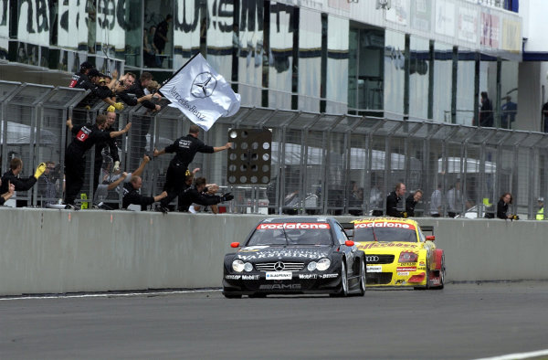 2002 DTM Championship 
Nurburgring, Germany. 2th - 4th August 2002. 
Race winner Uwe Alzen (mercedes CLK-DTM) crosses the finishline to the cheers of his team, closely followed by 2nd place finisher Laurent Aiello (Abt Audi TT-R), action.
World Copyright: Andre Irlmeier/LAT Photographic

