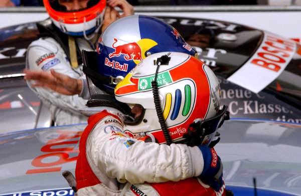 2004 DTM Championship 
Brno,Czech Republic. 18th - 19th September.
Tom Kristensen (Abt Sportsline Audi A4) congratulates winning team mate Mattias Ekstrom (Abt Sportsline Audi A4) after the race, as thrid place Gary Paffett (HWA Mercedes C-Class) looks on.
World Copyright: Andre Irlmeier/LAT Photographic 
ref: Digital Image Only