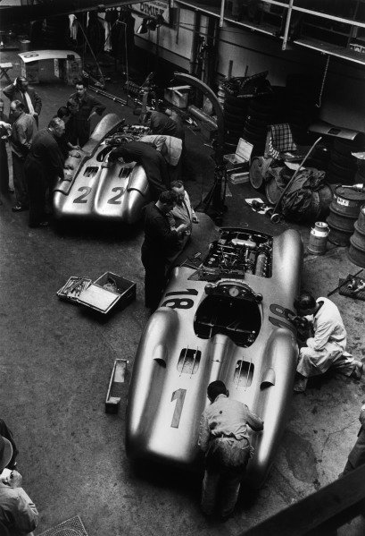 Reims, France. 4th July 1954.
The cars of Hans Herrmann, Mercedes-Benz W196 #22, retired, and Juan Manuel Fangio, Mercedes-Benz W196 #18, 1st position, being worked on in the paddock, garage.
World Copyright: LAT Photographic
Ref: Autosport B&W print. Published: Autosport, 16/7/1954 p82 Reims, France. 4th July 1954.
The cars of Hans Herrmann, Mercedes-Benz W196 #22, retired, and Juan Manuel Fangio, Mercedes-Benz W196 #18, 1st position, being worked on in the paddock, garage.
World Copyright: LAT Photographic
Ref: Autosport B&W print. Published: Autosport, 16/7/1954 p82