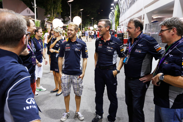 Marina Bay Circuit, Singapore.
Saturday 21st September 2013.
Sebastian Vettel, Red Bull Racing in the paddock with Christian Horner, Team Principal, Red Bull Racing, Andreas Sigl of Infiniti and other team members.
World Copyright: Charles Coates/LAT Photographic.
ref: Digital Image _N7T5545 Marina Bay Circuit, Singapore.
Saturday 21st September 2013.
Sebastian Vettel, Red Bull Racing in the paddock with Christian Horner, Team Principal, Red Bull Racing, Andreas Sigl of Infiniti and other team members.
World Copyright: Charles Coates/LAT Photographic.
ref: Digital Image _N7T5545