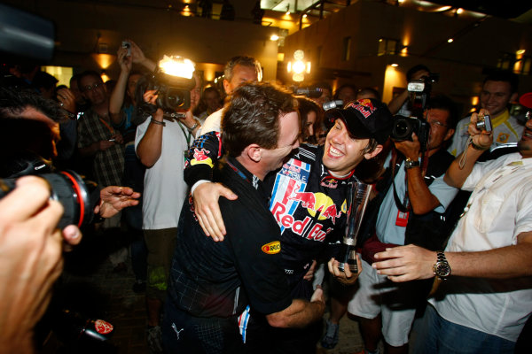 Yas Marina Circuit, Abu Dhabi, United Arab Emirates
1st November 2009.
Sebastian Vettel, Red Bull Racing RB5 Renault, 1st position, Mark Webber, Red Bull Racing RB5 Renault, 2nd position, Christian Horner, Team Principal, Red Bull Racing. and the Red Bull team celebrate their one-two finish. Portrait. 
World Copyright: Charles Coates/LAT Photographic 
ref: Digital Image _26Y3270