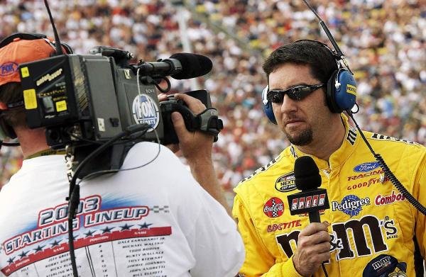 Fifth placed Elliott Sadler (USA) Robert Yates Racing M&M's Ford is interviewed prior to qualifying.
NASCAR Nextel Cup Series, Rd 15, DHL 400, Michigan International Speedway, Brooklyn, Michigan, USA, 20 June 2004.
DIGITAL IMAGE 