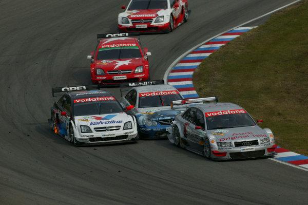 2004 DTM Championship.
Brno, Czech Repulic. 18th - 19th September
Emanuelle Pirro (Joest Audi A4) leads Markus Winkelhock (Persson Motorsport Mercedes CLK) , Peter Dumbreck (OPC Phoenix Opel Vectra GTS) , Heinz Harald Frentzen (OPC Holzer Opel Vectra GTS) and Timo Scheider (OPC Holzer Opel Vectra GTS). Action.
World Copyright: Andre Irlmeier/LAT Photographic
Ref:Digital image only 2004 DTM Championship.
Brno, Czech Repulic. 18th - 19th September
Emanuelle Pirro (Joest Audi A4) leads Markus Winkelhock (Persson Motorsport Mercedes CLK) , Peter Dumbreck (OPC Phoenix Opel Vectra GTS) , Heinz Harald Frentzen (OPC Holzer Opel Vectra GTS) and Timo Scheider (OPC Holzer Opel Vectra GTS). Action.
World Copyright: Andre Irlmeier/LAT Photographic
Ref:Digital image only